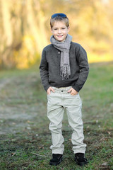 Wall Mural - portrait of little boy outdoors in autumn