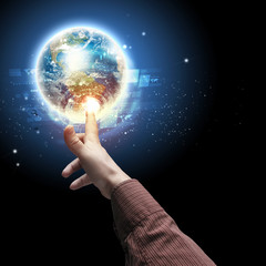 Wall Mural - hand touching the earth