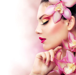 Wall Mural - Beautiful Girl With Orchid Flowers. Perfect Make-up