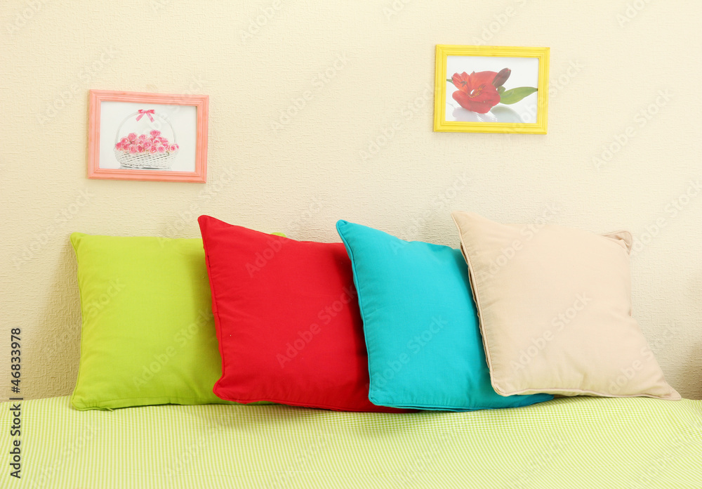 Empty bed with pillows and sheets in bedroom