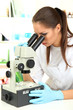 © Africa Studio - Young scientist looking into  microscope in  laboratory.
