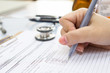 © jannoon028 - Doctor hand writing a medical recipe