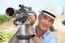 Man Looking Into A Tower Viewer
