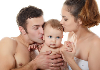 Wall Mural - Portrait of a young happy family with the kid