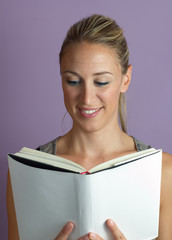 vertical portrait of a woman reading textbook