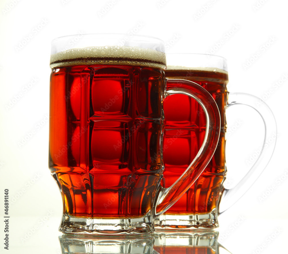 two tankards of kvass, isolated on white