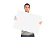 © whatafoto - Casual young man holding a banner against a white background
