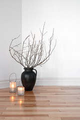 Lanterns and tree branches decorating a room