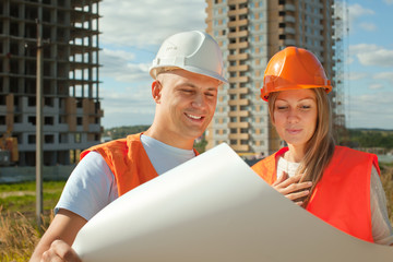 Wall Mural - two happy builders in hardhat