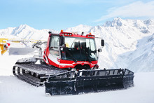 Red Machine For Skiing Slope Preparations In Austrian Alps