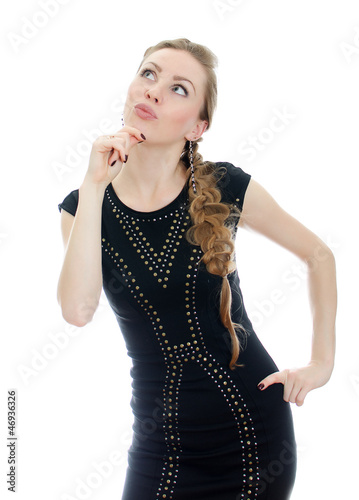 Fotografia, Obraz Woman with pigtail in black dress thinking. Isolated on white.