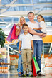 © pressmaster - Family in the mall