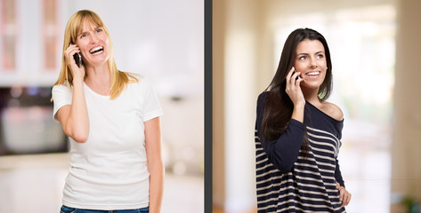 Wall Mural - Portrait Of Happy Women Talking On Cellphone