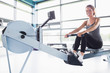 © WavebreakmediaMicro - Woman training happily on row machine
