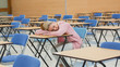 © WavebreakMediaMicro - Woman napping in exam hall