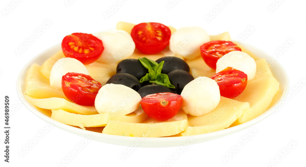 sliced mozzarella cheese with vegetables in the plate isolated