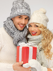 Sticker - romantic couple in a sweaters with gift box