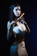 © Demian - Sensuality brunette with a wooden flute
