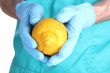 A scientist holds a genetically modified lemon