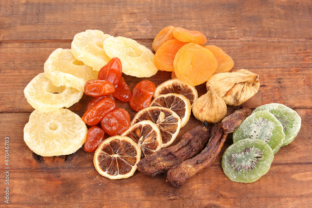 Dried fruits on wooden background