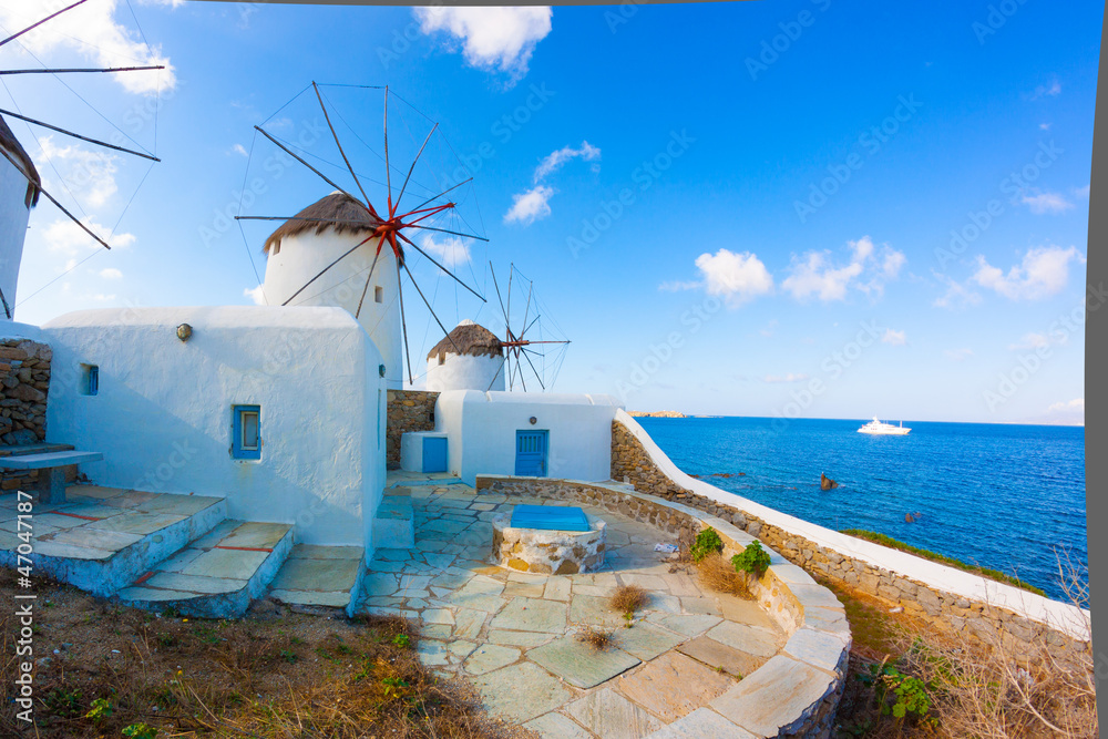 Panoramic view of two windmills and their bases Mykonos Greece C - obrazy, fototapety, plakaty 