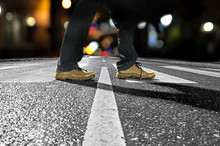 Man Crossing Street At Night