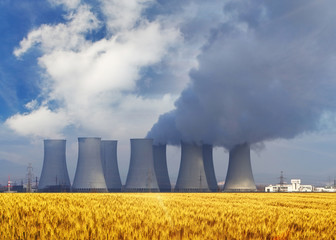 Wall Mural - Nuclear power plant with yellow field and sun