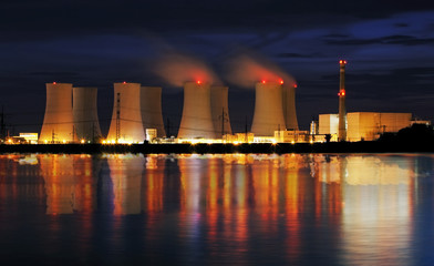 Wall Mural - Nuclear power plant by night with reflection