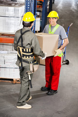 Wall Mural - Foremen Carrying Cardboard Box At Warehouse