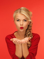 Poster - woman blowing something on the palms of her hands