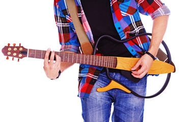 Clsoe portrait of young rocker posing in studio on white backgro