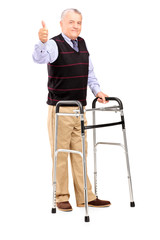 Wall Mural - Mature gentleman using a walker and giving a thumb up