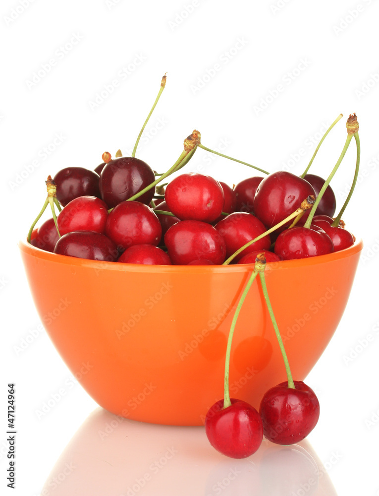 cherry in a orange bowl isolated on white