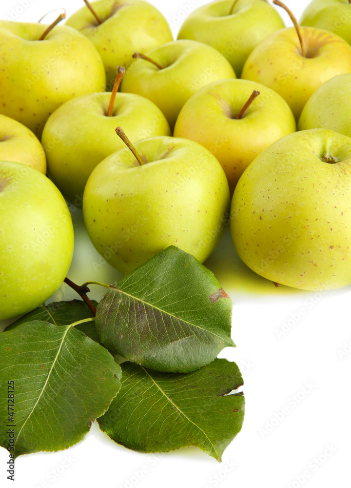 juicy apples with green leaves, isolated on white