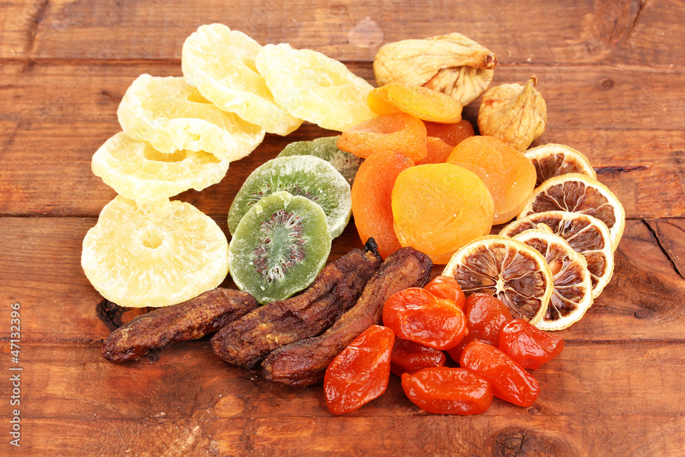 Dried fruits on wooden background