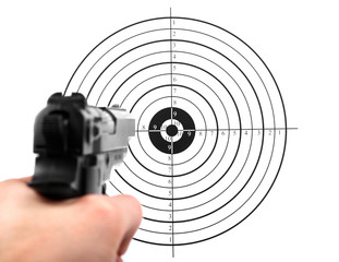 hand with gun shooting target