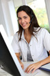 © goodluz - Portrait of smiling medical secretary working on desktop