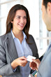 © goodluz - Business people exchanging business card