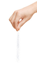 Hand Adding Salt On A White Background