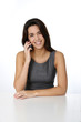© goodluz - Smiling brunette talking on mobile phone