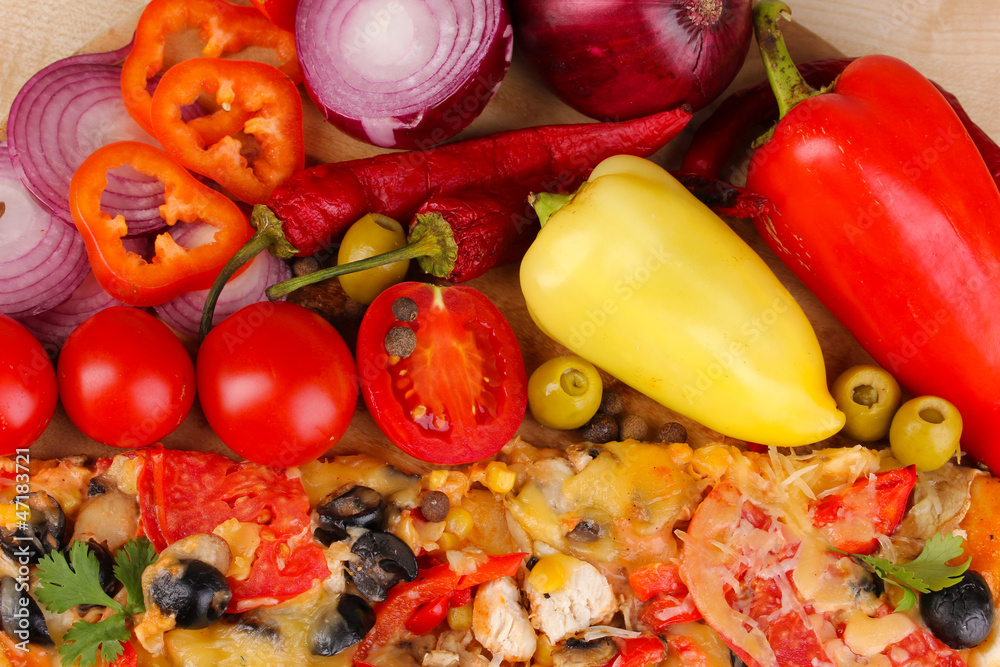 Delicious pizza with ingredients close-up