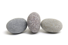 Three Pebbles Placed On White
