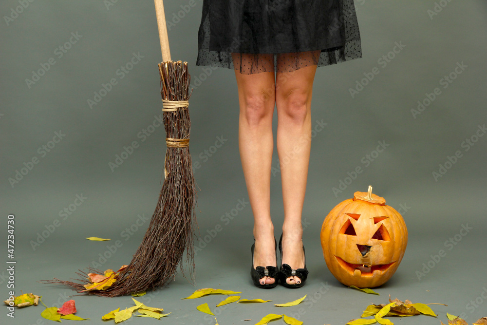 Halloween background with pretty female legs