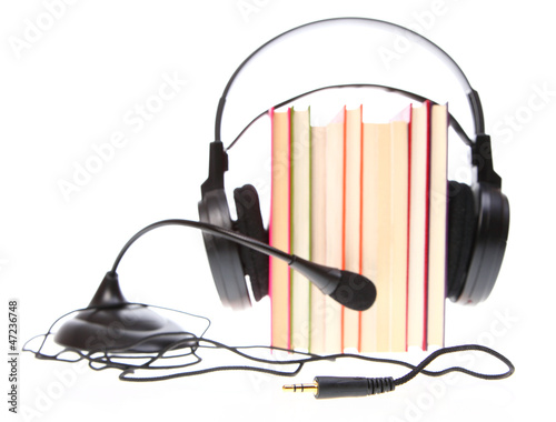 Fotografia, Obraz Books stack and headset with a microphone isolated