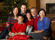 © Monkey Business - Multi Generation Family In Front Of Christmas Tree