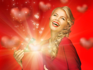 Wall Mural - lovely woman in red dress with valentine gift box