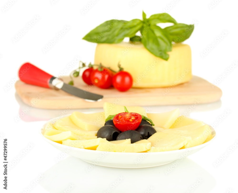 sliced mozzarella cheese with vegetables in the plate isolated