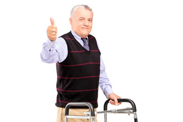 Poster - A mature gentleman using a walker and giving a thumb up