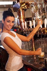 Sticker - Female bartender tapping draught beer in pub