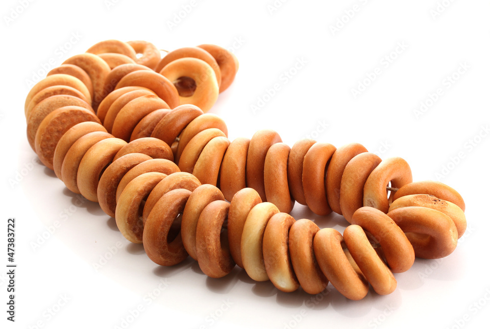 tasty bagels on rope, isolated on white